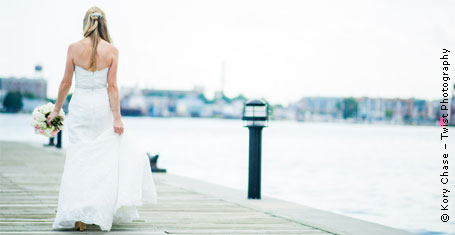 Photograph: Bride on a dock looking at the water